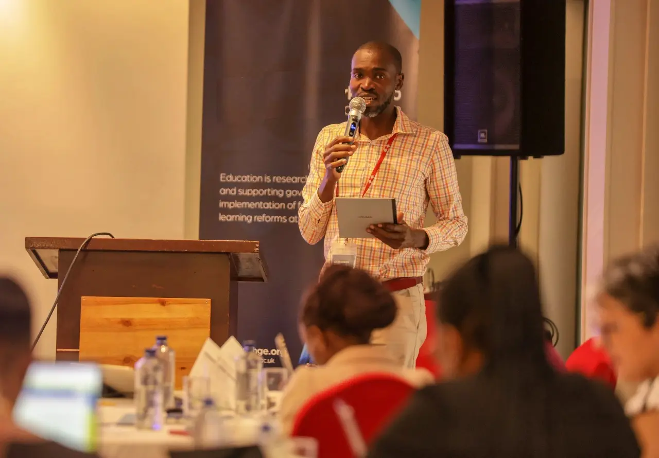 Eric Nyamwaro presenting at an education workshop